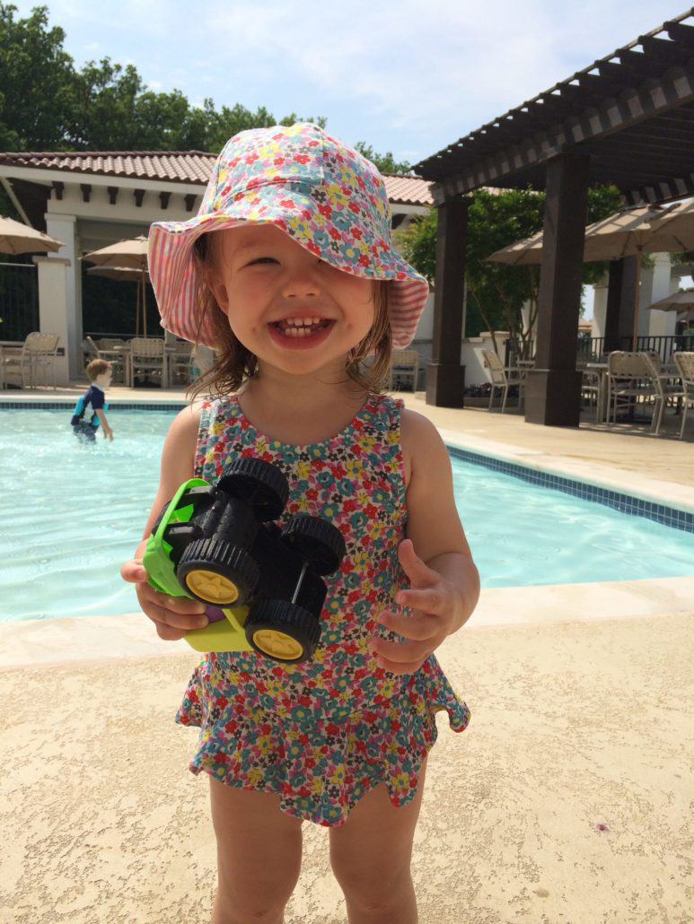 Child enjoying summer safely with sun protection — Spring Valley Pediatrics Washington DC