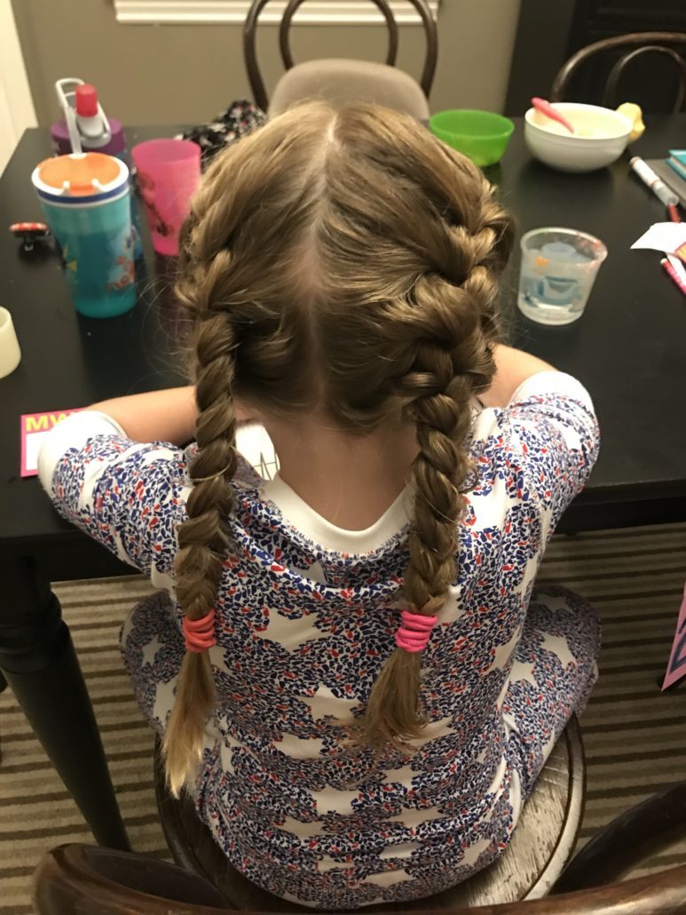 Child's hair being checked for head lice — Spring Valley Pediatrics Washington DC